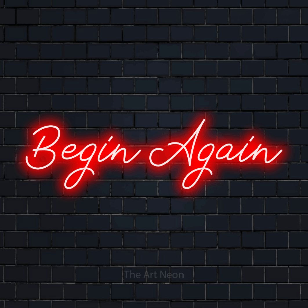 "Begin Again" LED neon sign on a black brick wall