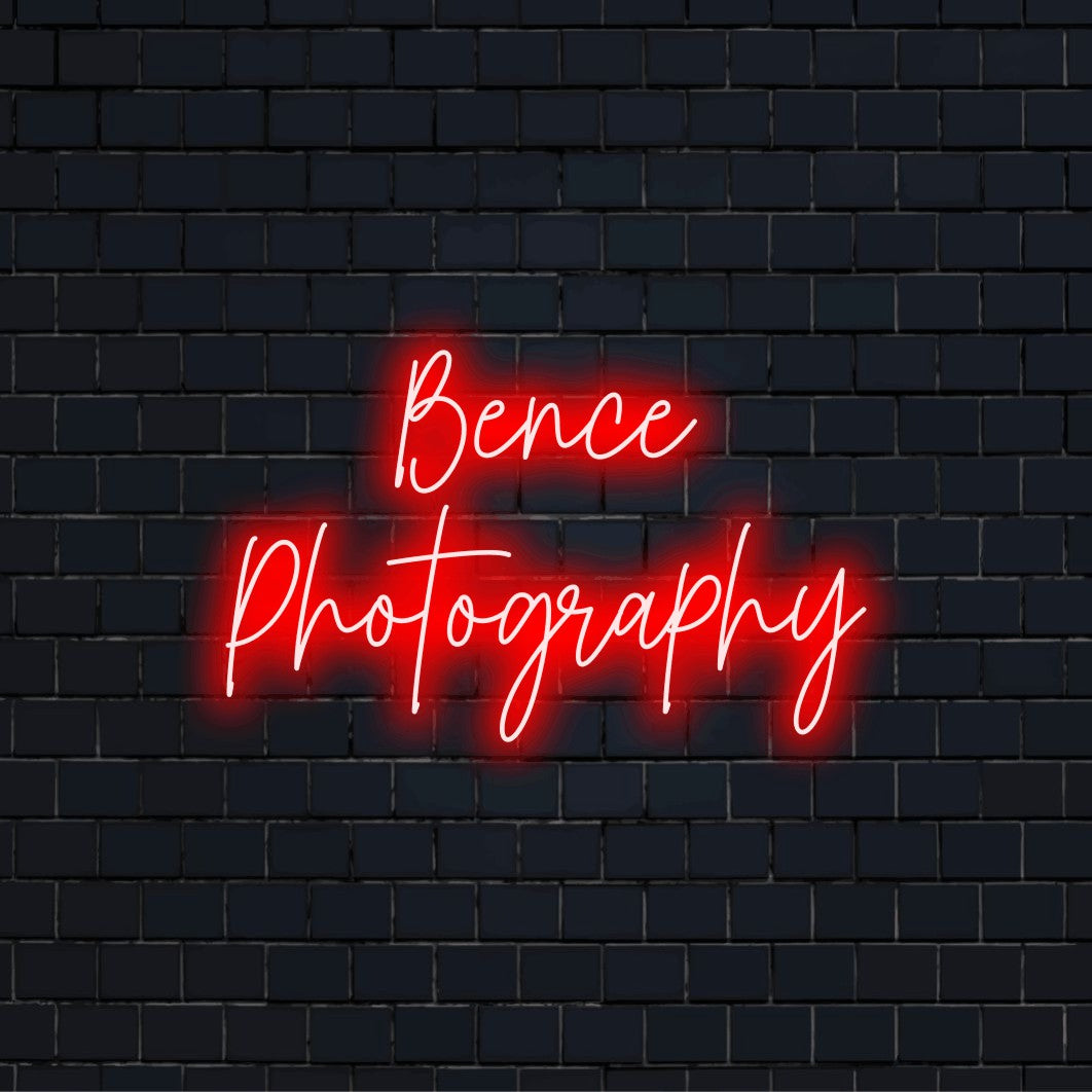 Bence Photography Personalized LED Neon Sign, glowing neon text against black brick wall