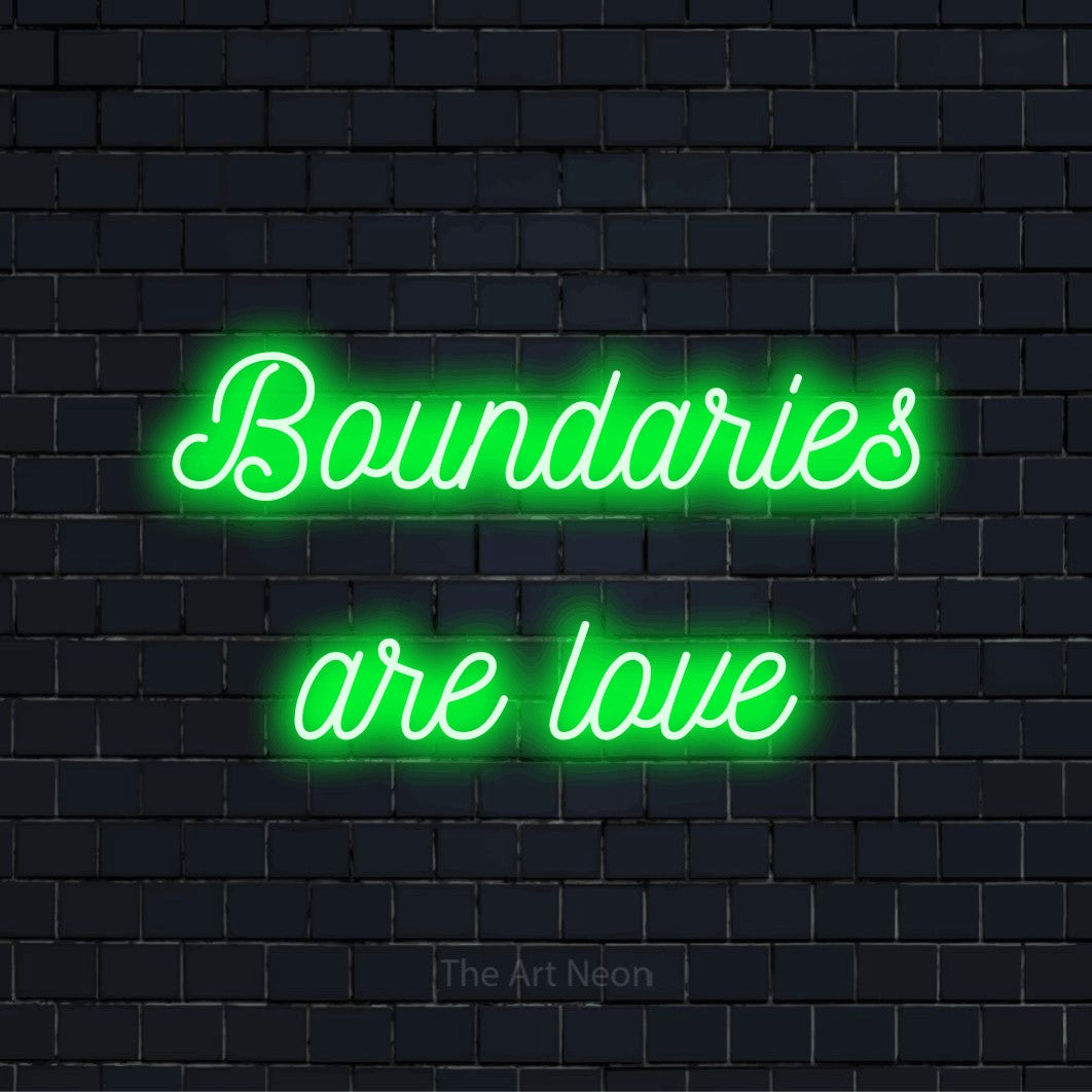 "Boundaries Are Love" script-style LED neon sign on a black brick wall