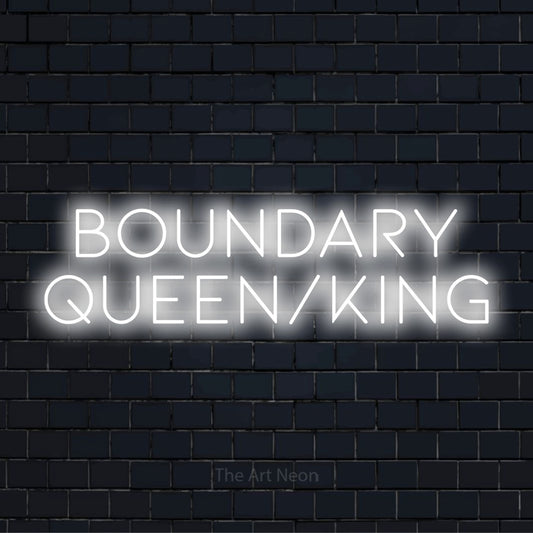"Boundary Queen/king" neon text design on a black brick wall