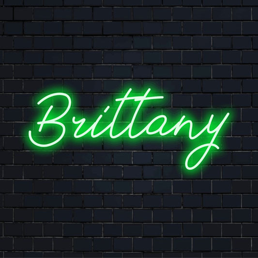 Brittany LED Neon Sign, bright neon glow on dark brick wall