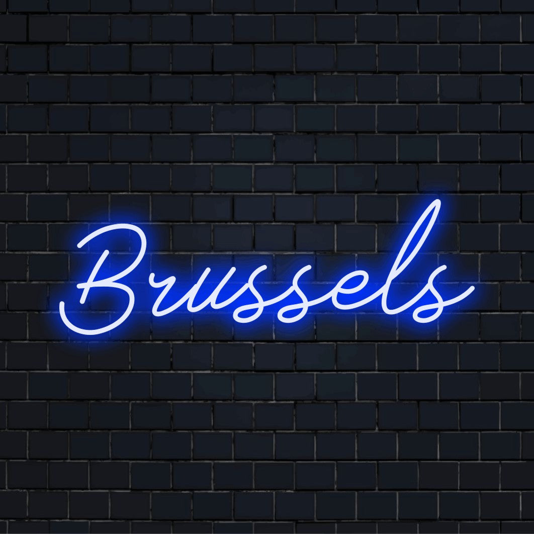 Brussels Neon Sign, glowing lettering against black brick wall