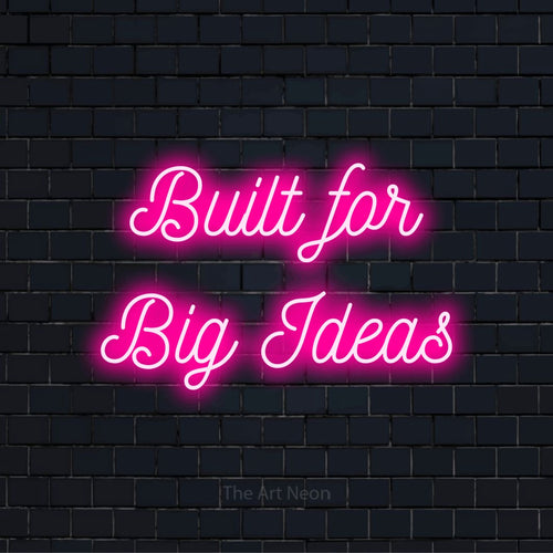 "Built For Big Ideas" glowing LED neon sign on a black brick wall