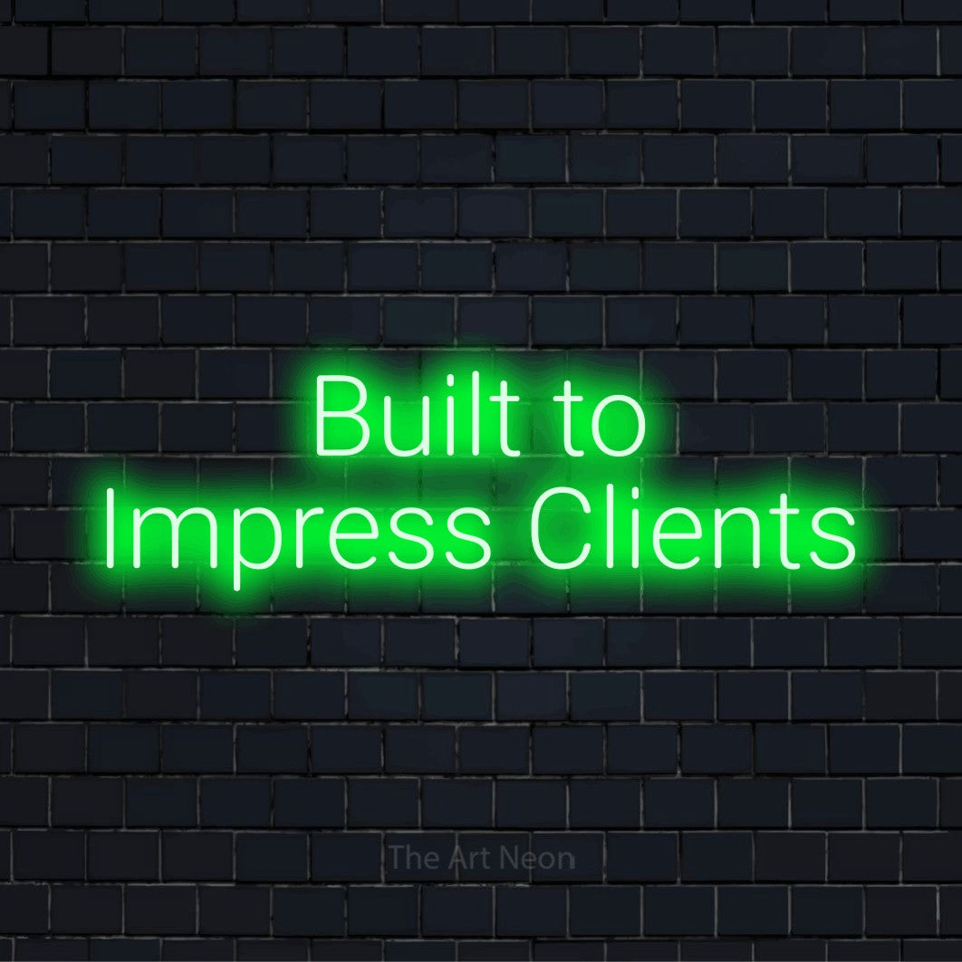 "Built To Impress Clients" neon text design on a black brick wall