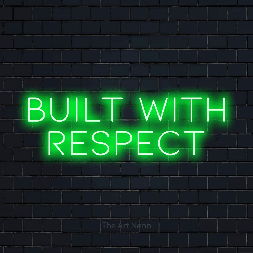 "Built With Respect" glowing LED neon sign on a black brick wall