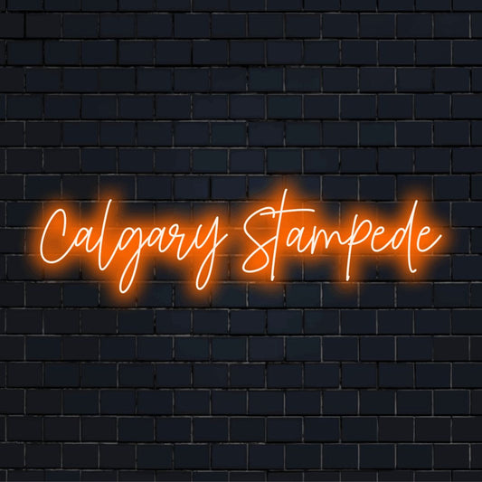 Calgary Stampede LED Neon Sign, soft neon glow on dark brick wall