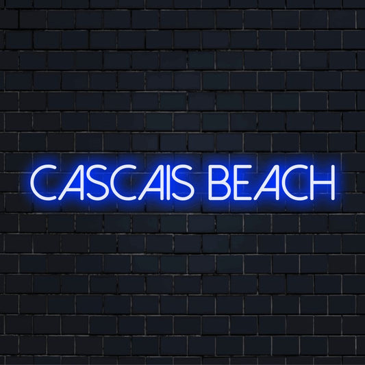 Cascais Beach Neon Sign, bright neon lettering against brick backdrop