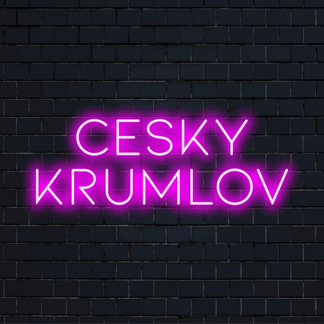 Cesky Krumlov Neon Light with bright LED glow on dark brick wall