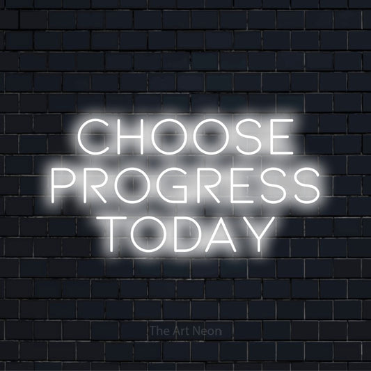 "Choose Progress Today" neon text design on a black brick wall