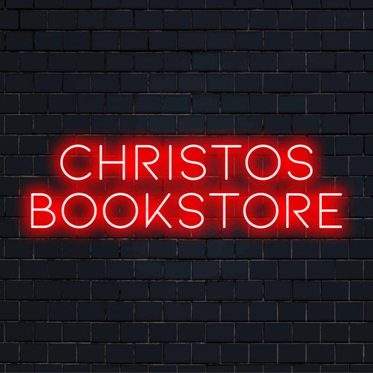 Christos Bookstore Personalized LED Neon Sign, glowing lettering against black brick wall