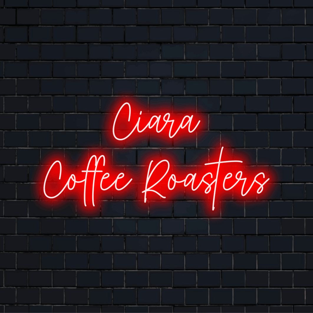 Ciara Coffee Roasters Custom Name Neon Sign, bright LED glow against brick backdrop