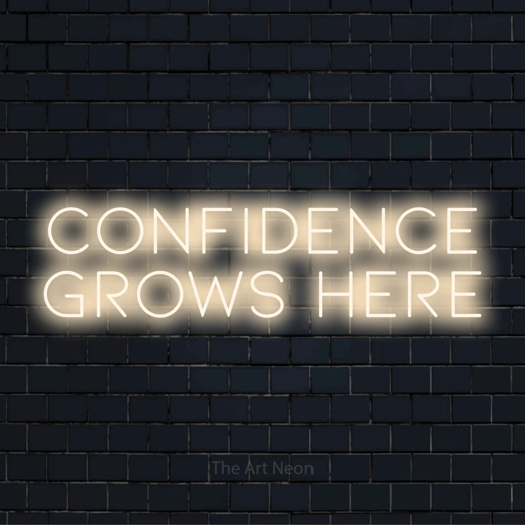 "Confidence Grows Here" neon text design on a black brick wall