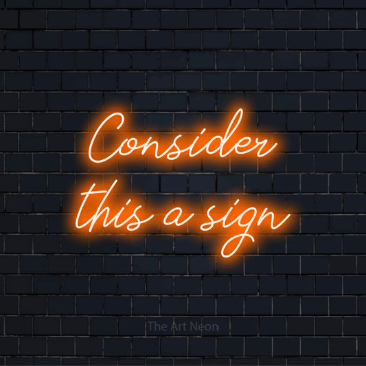 "Consider This A Sign" LED neon sign on a black brick wall