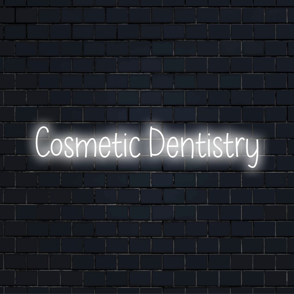 Cosmetic Dentistry Neon Sign, neon text light against black brick wall