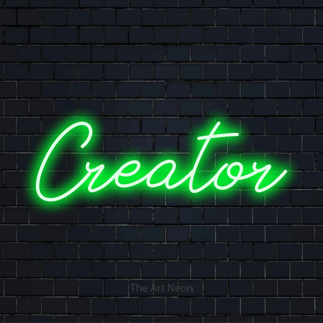 "Creator" neon text design on a black brick wall