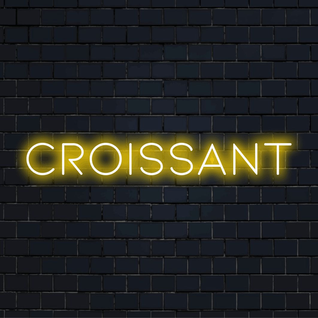 Croissant Neon Sign, glowing wall decor on dark brick background