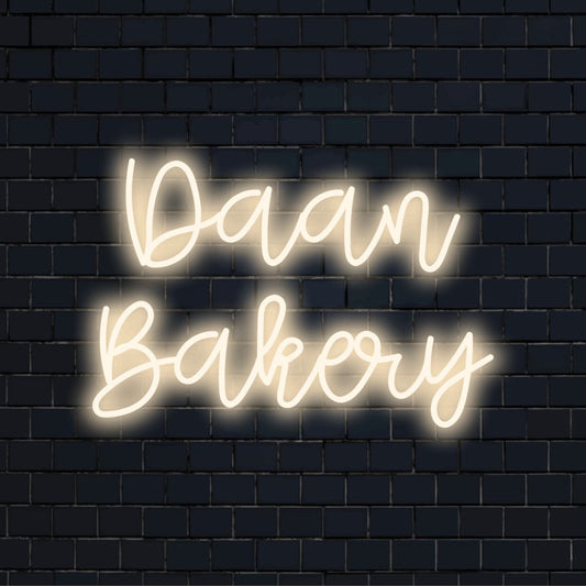 Daan Bakery Personalized Neon Light with glowing lettering on black brick background