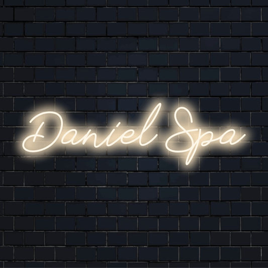 Daniel Spa Custom Name Neon Sign, bright neon glow on dark brick background