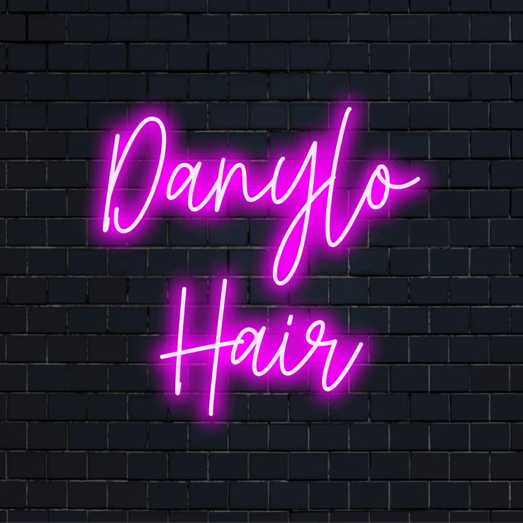 Danylo Hair Personalized Neon Light with neon text light against brick backdrop