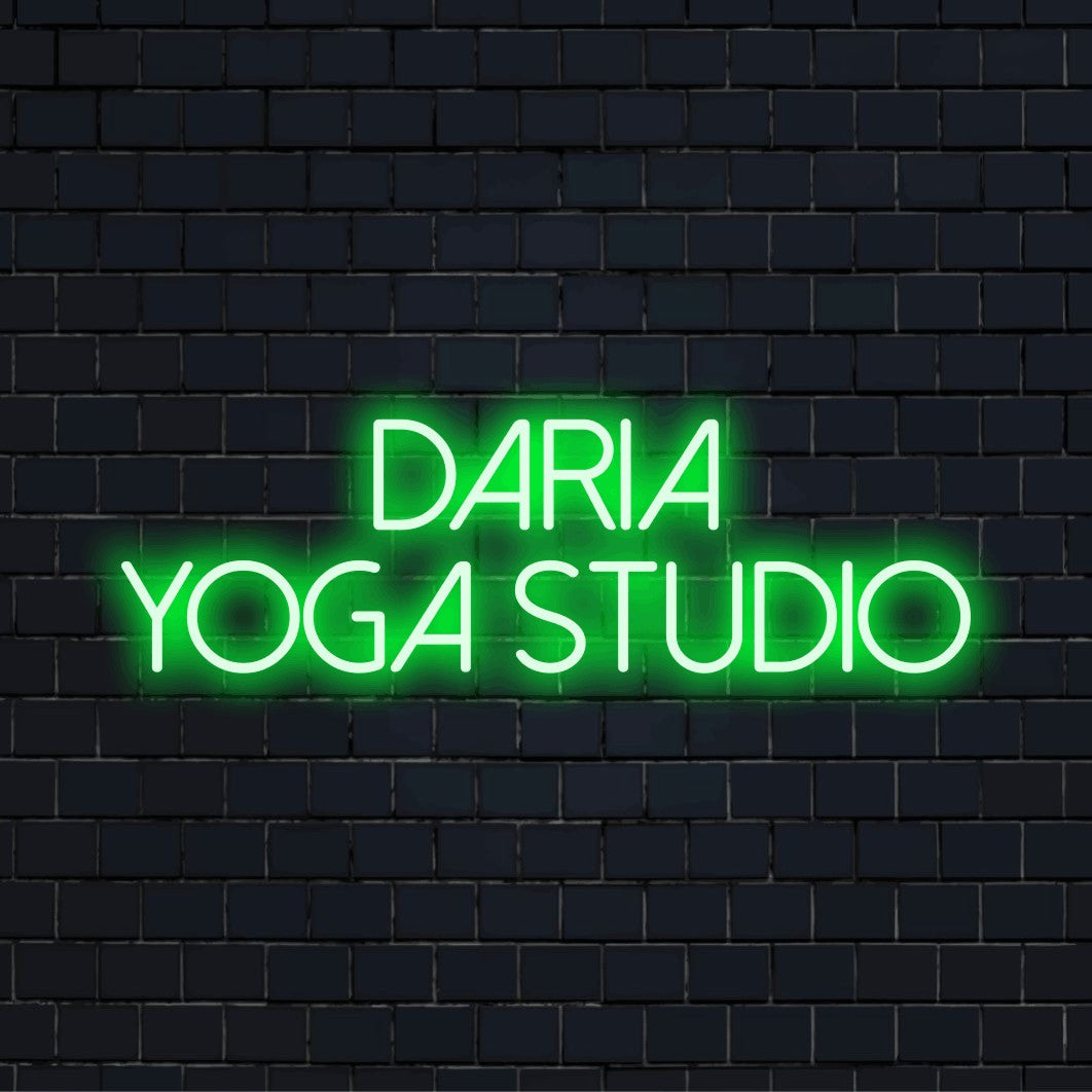 Daria Yoga Studio Custom Name Neon Sign, glowing neon text on black brick background
