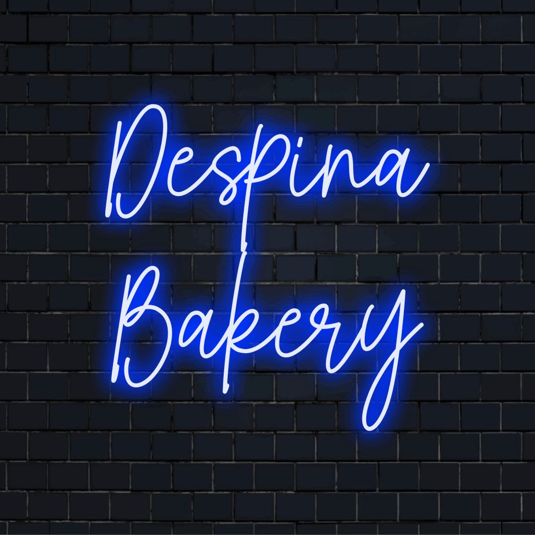 Despina Bakery Custom Name Neon Sign, neon text light against brick backdrop