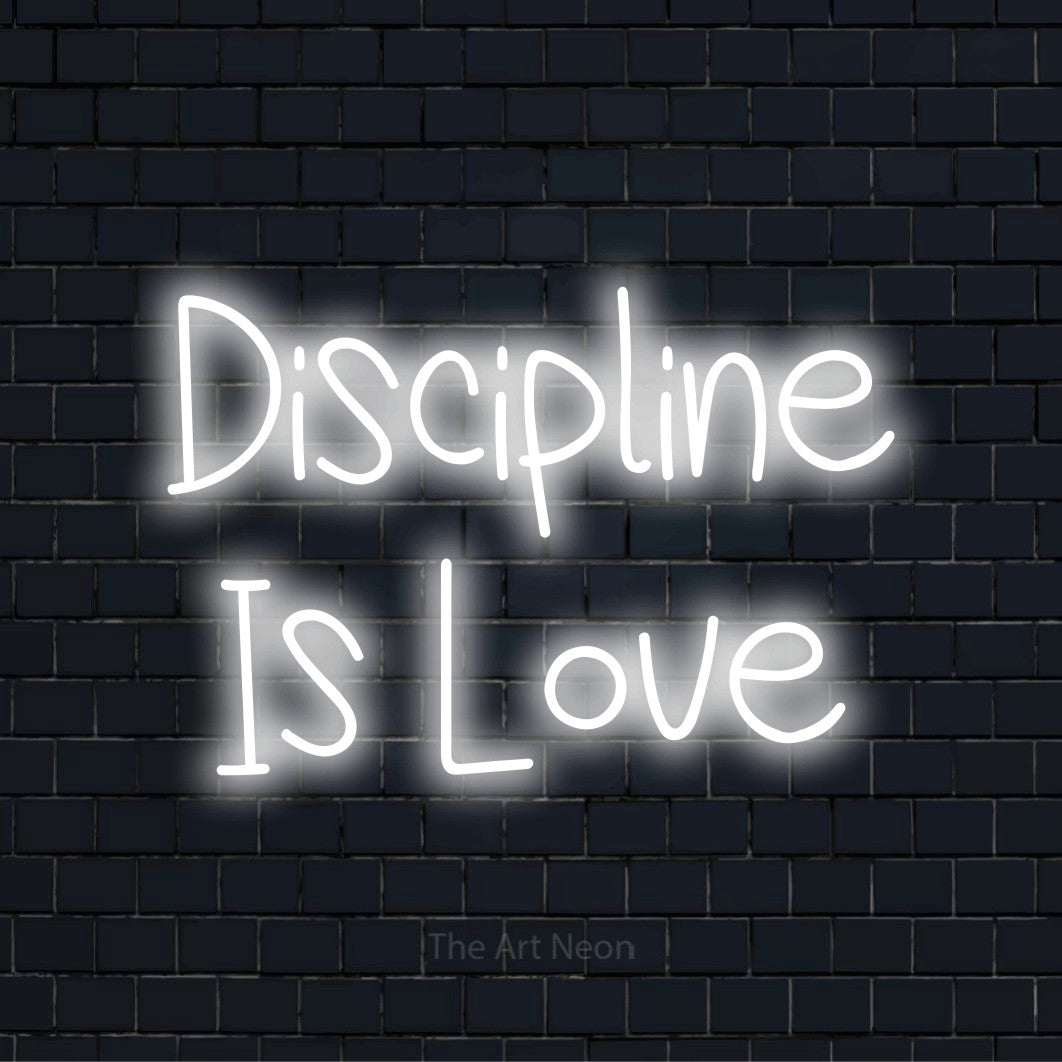 "Discipline Is Love" LED neon sign on a black brick wall