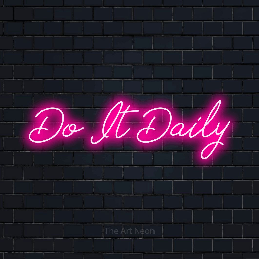 "Do It Daily" script-style LED neon sign on a black brick wall