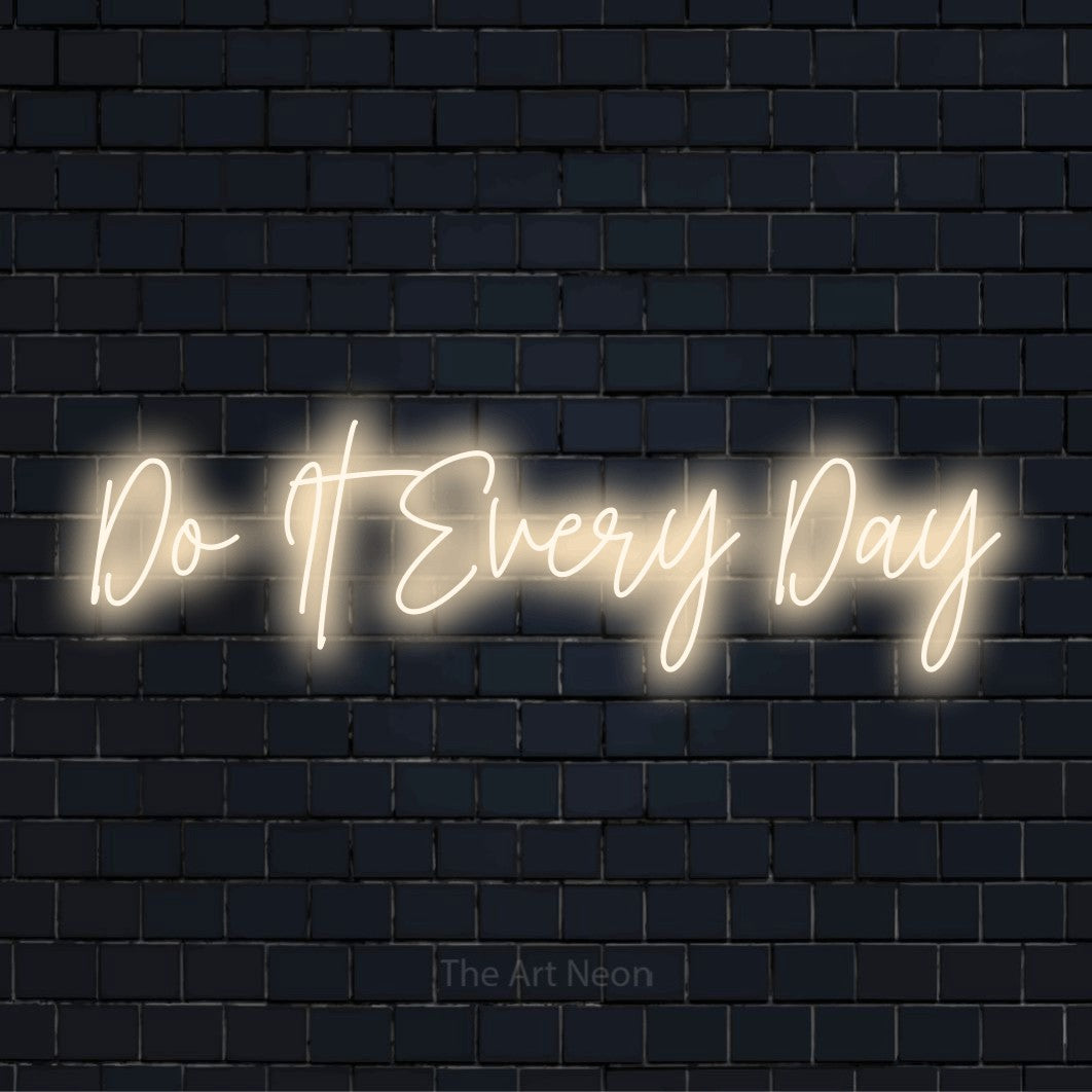 "Do It Every Day" glowing LED neon sign on a black brick wall