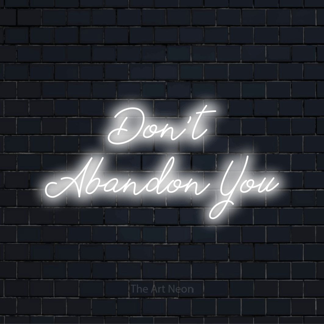 "Don’t Abandon You" LED neon sign on a black brick wall