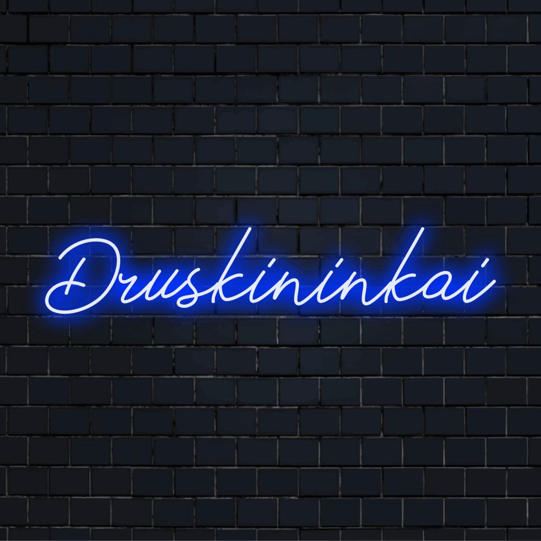 Druskininkai Neon Light with glowing lettering against black brick wall