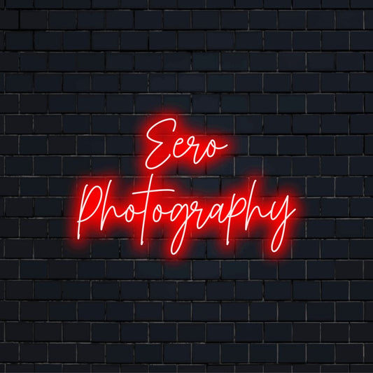 Eero Photography Personalized Neon Light with bright neon glow on dark brick background