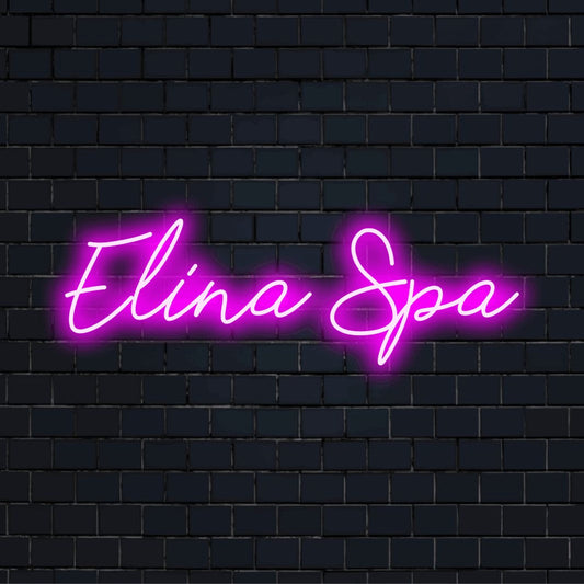 Elina Spa Custom Name Neon Sign, glowing lettering against black brick wall