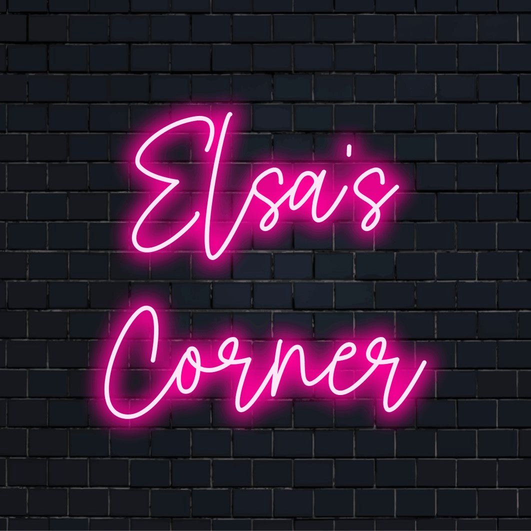Elsa_s Corner Custom Name Neon Sign, glowing lettering against black brick wall