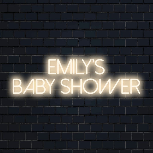 Emily_s Baby Shower Custom Name Neon Sign, bright LED glow against black brick wall