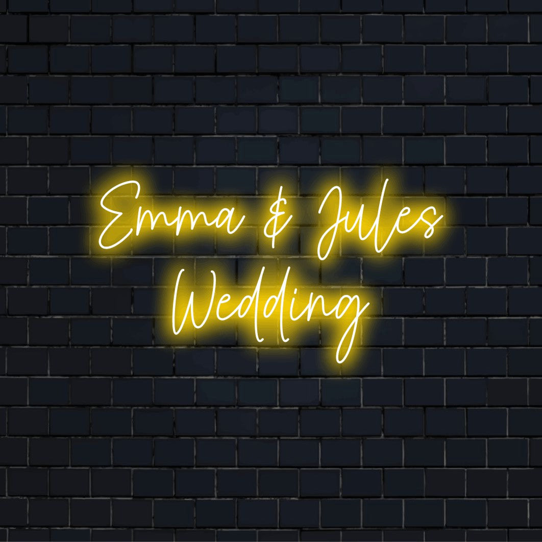 Emma _ Jules Wedding Personalized LED Neon Sign, glowing neon text against black brick wall