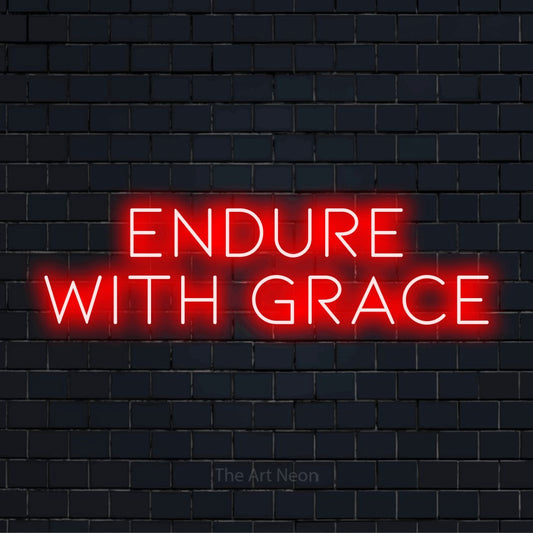 "Endure With Grace" script-style LED neon sign on a black brick wall