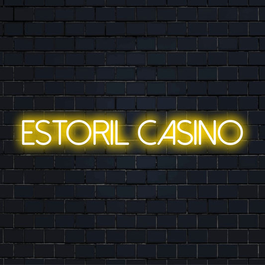 Estoril Casino Neon Light with neon text light against black brick wall