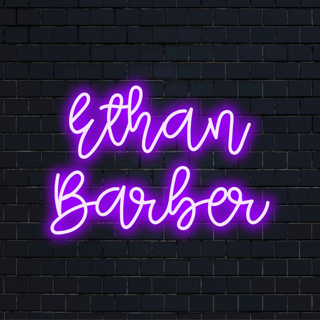 Ethan Barber Personalized Neon Light with glowing lettering on dark brick background