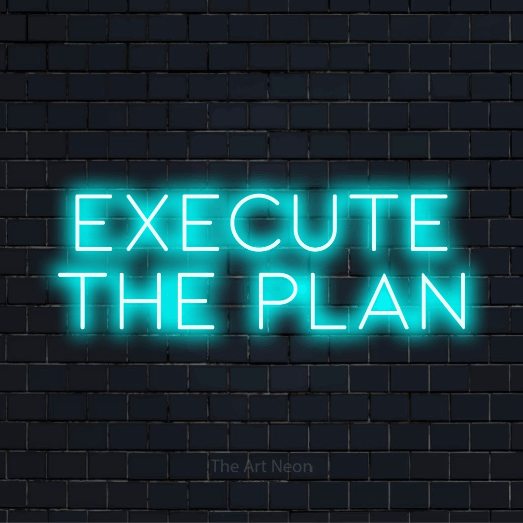 "Execute The Plan" script-style LED neon sign on a black brick wall