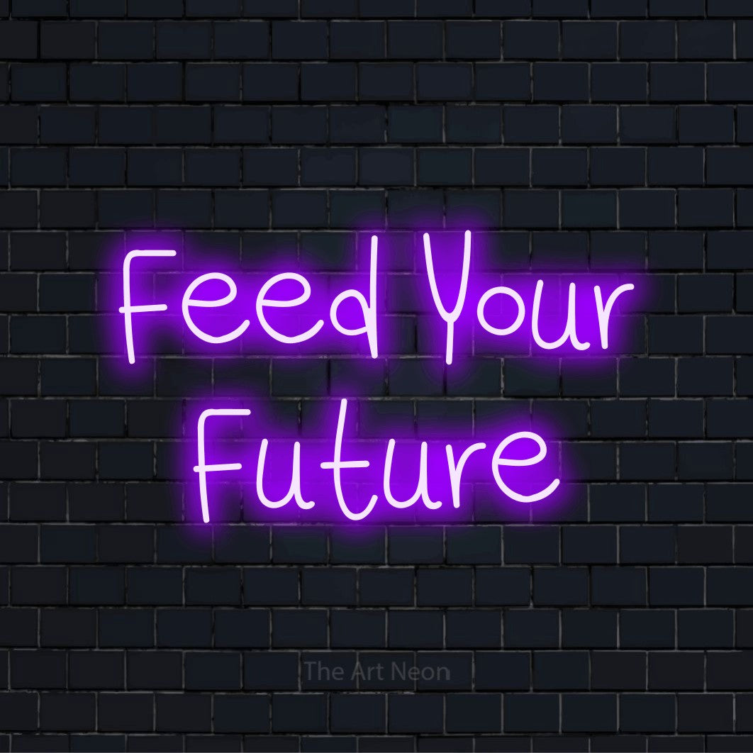 "Feed Your Future" LED neon sign on a black brick wall