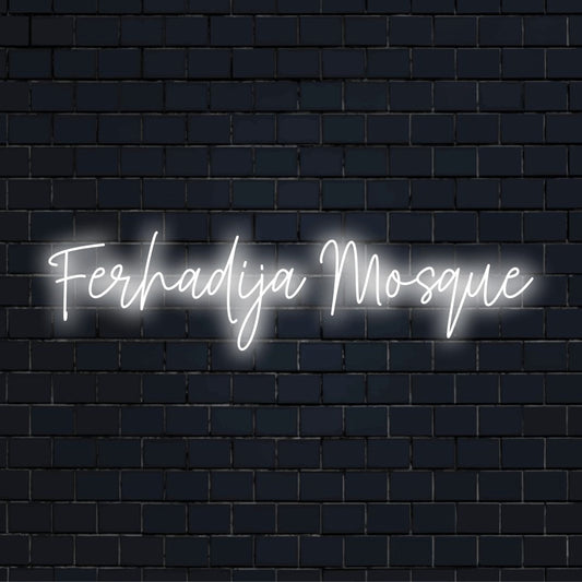 Ferhadija Mosque LED Neon Sign, bright neon lettering on dark brick wall
