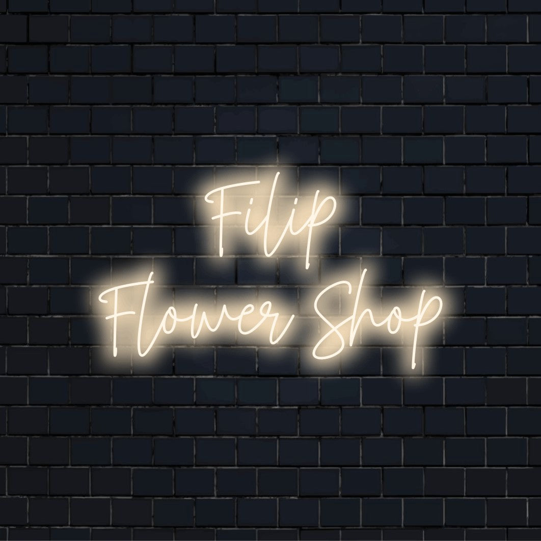 Filip Flower Shop Personalized LED Neon Sign, glowing wall decor against black brick wall