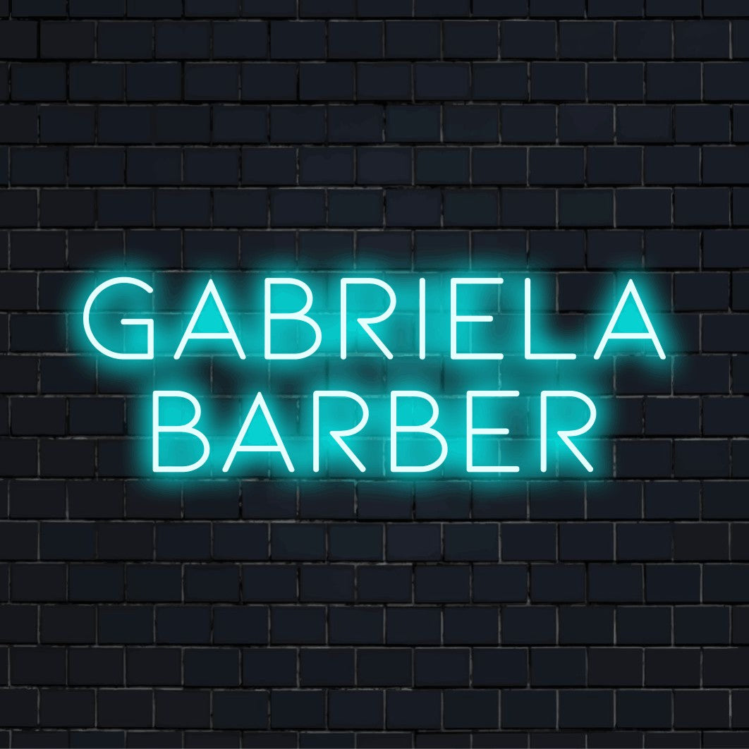 Gabriela Barber Custom Name Neon Sign, soft neon glow against black brick wall