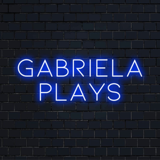 Gabriela Plays Personalized Neon Light with glowing neon text on dark brick wall