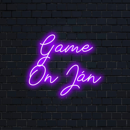 Game On Jan Custom Name Neon Sign, glowing neon text on black brick background