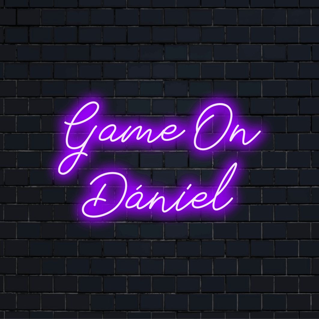Game On Daniel Custom Name Neon Sign, bright neon lettering on dark brick background