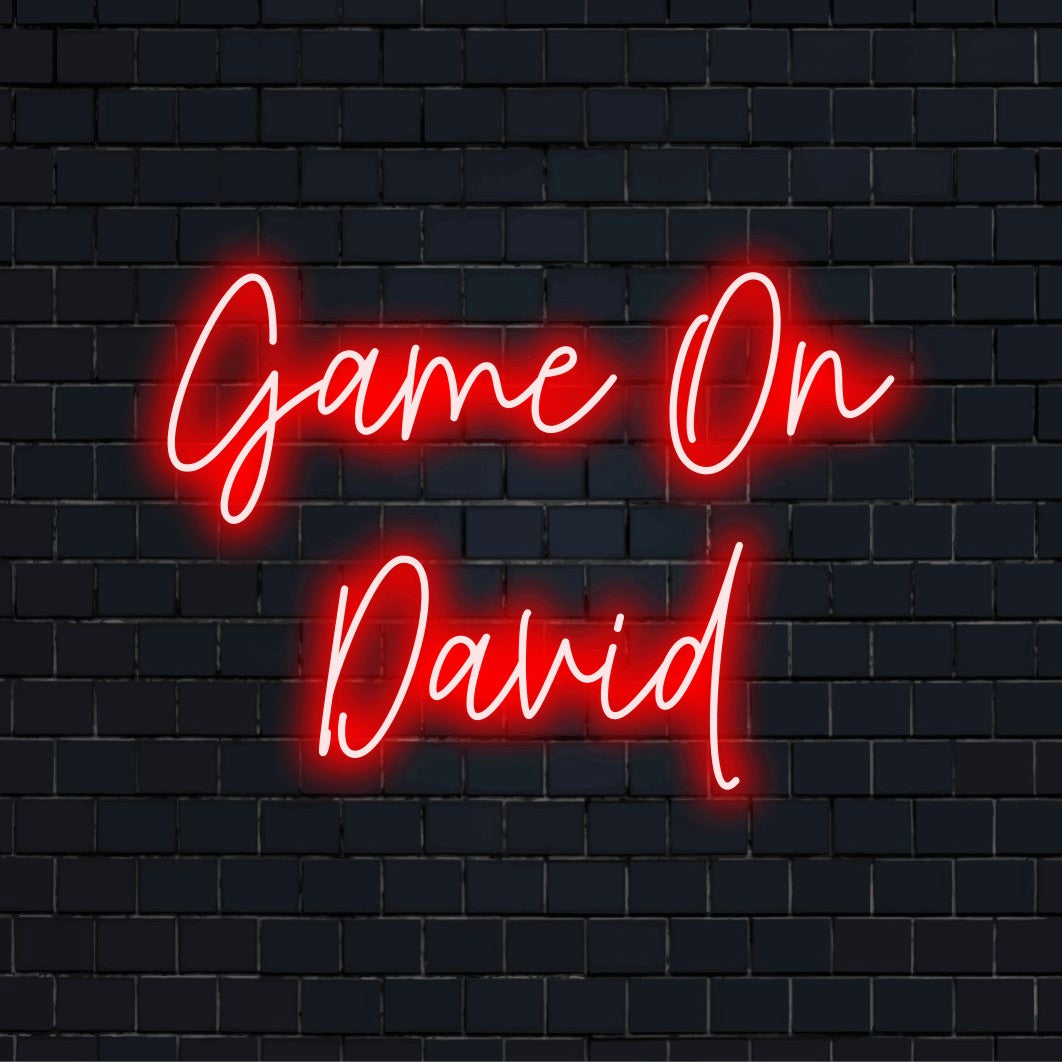 Game On David Custom Name Neon Sign, glowing neon text on black brick background