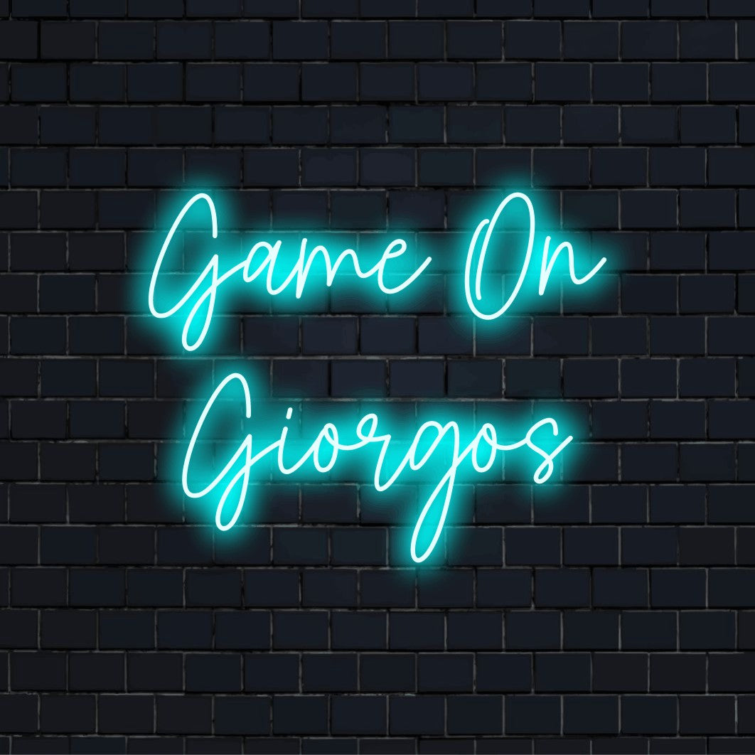 Game On Giorgos Custom Name Neon Sign, bright neon lettering on black brick background