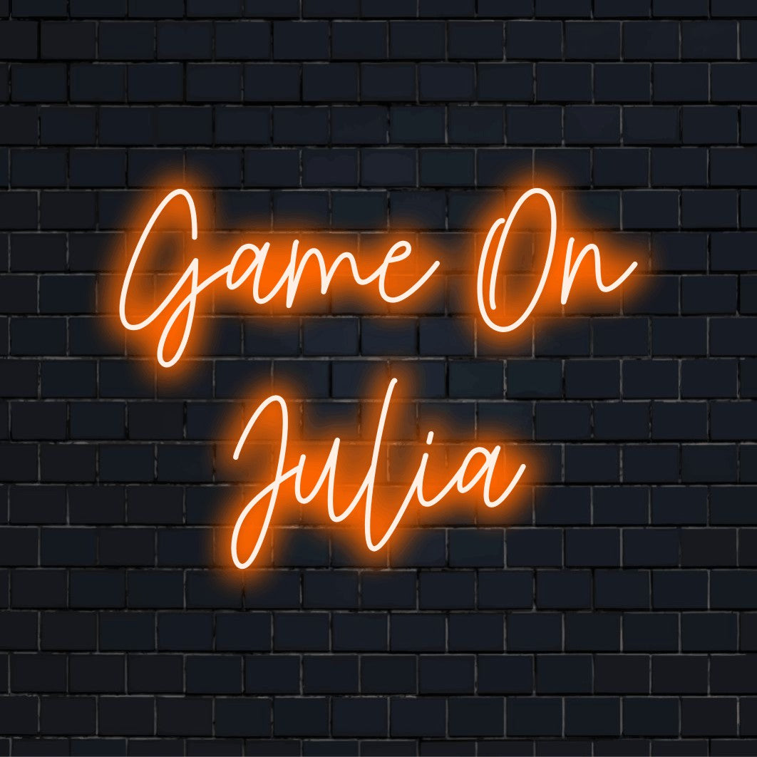 Game On Julia Custom Name Neon Sign, soft neon glow against black brick wall