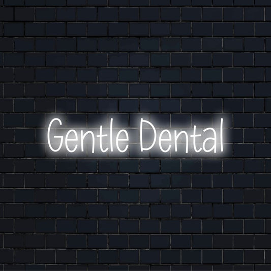 Gentle Dental Neon Sign, bright neon lettering against brick backdrop